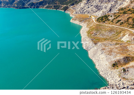 Top view of the shore of a mountain lake in autumn. Kolnbreinspeicher, Gamskarnock, Austria Europe Top view of the shore of a mountain lake in autumn. Kolnbreinspeicher, Gamskarnock, Austria Europe 126193434