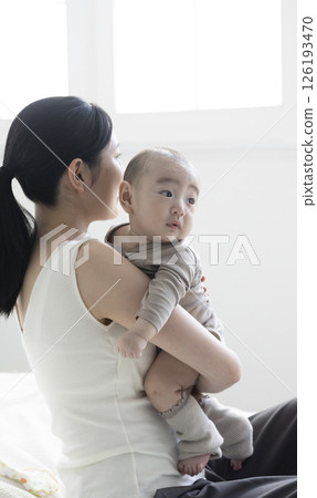 Mother holding a baby Mother holding a baby 126193470