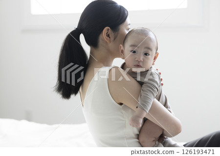 Mother holding a baby Mother holding a baby 126193471