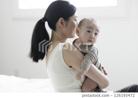 Mother holding a baby Mother holding a baby 126193472
