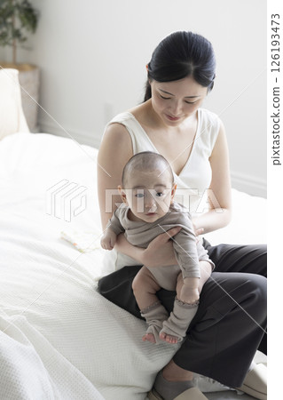 Mother holding a baby Mother holding a baby 126193473