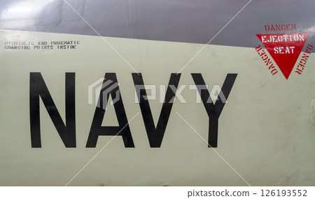 Vintage aircraft fuselage with navy markings and ejection seat warning Vintage aircraft fuselage with navy markings and ejection seat warning 126193552
