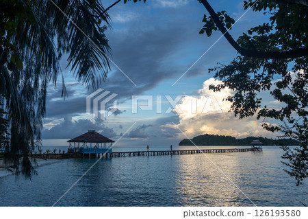 Sunset view of pier on Kadidiri Island, Togian archipelago, Sulawesi, Indonesia Sunset view of pier on Kadidiri Island, Togian archipelago, Sulawesi, Indonesia 126193580