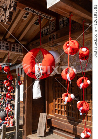 Sarubobo dolls at Hida Kokubun-ji Temple in Takayama, Japan 126193583