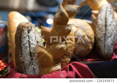 Assorted artisan bread Variety of sourdough bread on wooden table, loaf of artisan bread. High quality photo 126193673