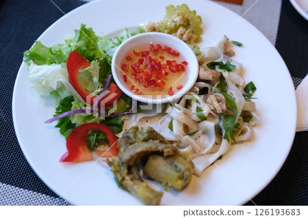 rice vermicelli with soy salad and chili fish sauce vietnamese asian food on white plate rice vermicelli with soy salad and chili fish sauce vietnamese asian food on white plate 126193683