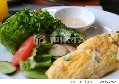 Breakfast, omelette with stuffed egg and vegetables 126193706