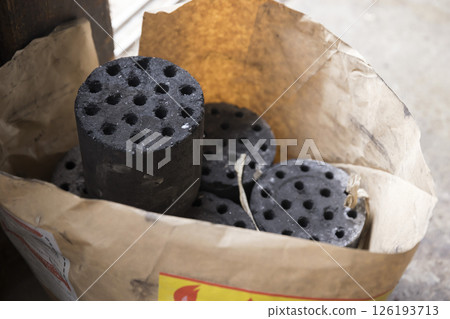 Charcoal briquettes on the floor Charcoal briquettes on the floor 126193713