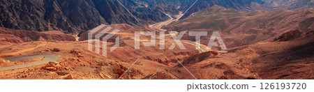 Beautiful mountain landscape with winding mountain road. Mountains background. Horizontal banner 126193720