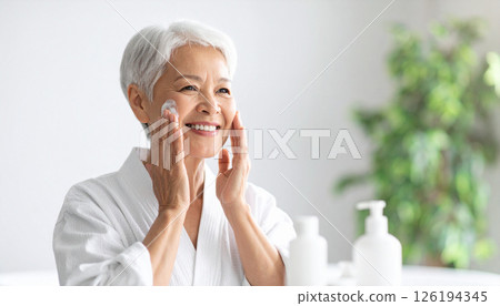 Senior woman washing her face (AI-generated image) Senior woman washing her face (AI-generated image) 126194345