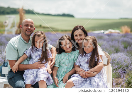 A lavender field creates a magical landscape for a family vacation. 126194380