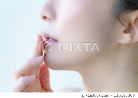 Profile of a young woman with her finger on her lips. Photo courtesy of Tokyo Electronics College, Denpa Gakuen Corporation. Profile of a young woman with her finger on her lips. Photo courtesy of Tokyo Electronics College, Denpa Gakuen Corporation. 126195367