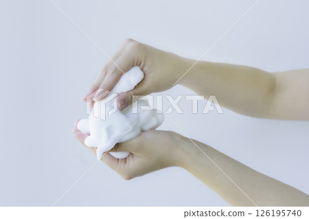 A close-up of a young woman's hands lathering face wash with both hands. Photo courtesy of Denpa Gakuen Tokyo Electronics College. A close-up of a young woman's hands lathering face wash with both hands. Photo courtesy of Denpa Gakuen Tokyo Electronics College. 126195740