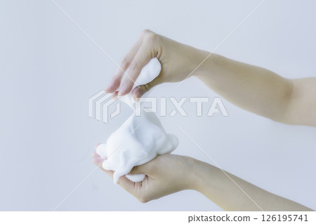 A close-up of a young woman's hands lathering face wash with both hands. Photo courtesy of Denpa Gakuen Tokyo Electronics College. A close-up of a young woman's hands lathering face wash with both hands. Photo courtesy of Denpa Gakuen Tokyo Electronics College. 126195741