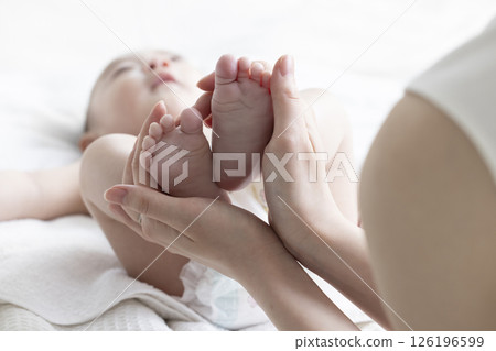 Mom giving baby massage to baby 126196599