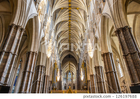 Intricate details of the gothic architecture in Westminster Abbey showcase stunning arches, elaborate columns, and beautiful chandeliers, creating a serene atmosphere in this historic site in London. Intricate details of the gothic architecture in Westminster Abbey showcase stunning arches, elaborate columns, and beautiful chandeliers, creating a serene atmosphere in this historic site in London. 126197688
