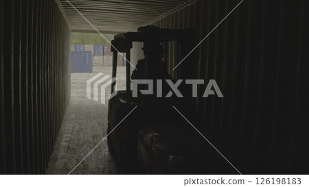 A forklift transports goods through a wide warehouse passageway, enhancing efficiency. Stock Footage A forklift transports goods through a wide warehouse passageway, enhancing efficiency. Stock Footage 126198183