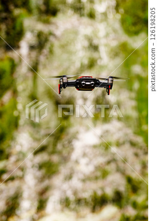 Drone flying against norwegian nature Drone flying against norwegian nature 126198205