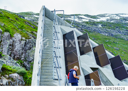 Tourist on Utsikten viewpoint, Norway 126198228