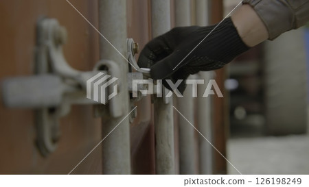 A Detailed Close Up View of the Locking Mechanism Found on Cargo Shipping Containers. Stock Footage A Detailed Close Up View of the Locking Mechanism Found on Cargo Shipping Containers. Stock Footage 126198249