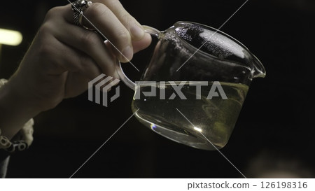 A Beautiful and Vibrant Herbal Drink Served in a Glass Pitcher for Refreshment. Media A Beautiful and Vibrant Herbal Drink Served in a Glass Pitcher for Refreshment. Media 126198316