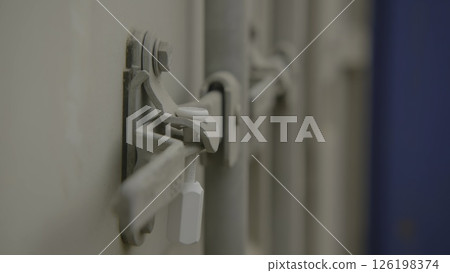 Close up of a metal lock on a storage container, showcasing its design and function. Stock Footage Close up of a metal lock on a storage container, showcasing its design and function. Stock Footage 126198374