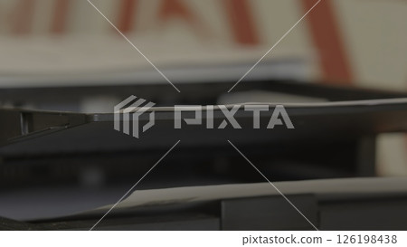 Documents Neatly Stacked on a Printer Shelf in an Organized Office Workspace Environment. Stock Footage Documents Neatly Stacked on a Printer Shelf in an Organized Office Workspace Environment. Stock Footage 126198438