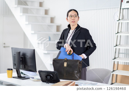 A female employee of a construction company preparing to depart 126198468