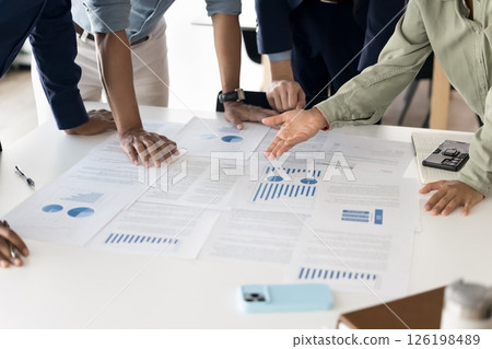 Employees analyzing sales result, do marketing research, closeup Employees analyzing sales result, do marketing research, closeup 126198489