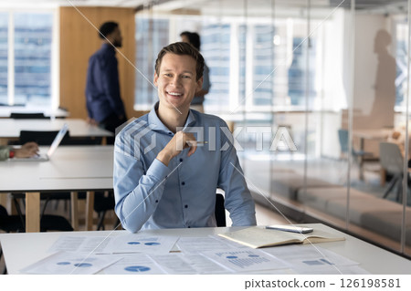 Businessman evaluate sales results, analyzing market trends, reviewing financial statements 126198581