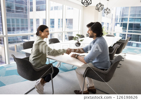 Applicant getting hired, shake hand HR manager, finish job interview 126198626