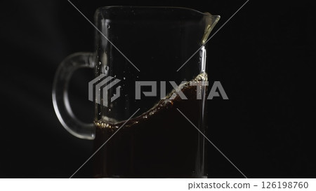 Brewing Coffee in a Glass Pitcher for an Invigorating Morning Beverage Experience. Media 126198760