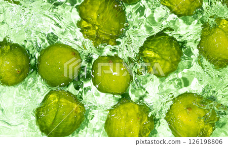 Vibrant Limes Submerged in Water Surface Scene 126198806