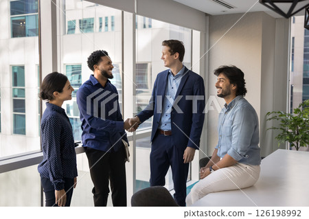 Two businessmen shaking hands, making gesture of agreement and partnership 126198992