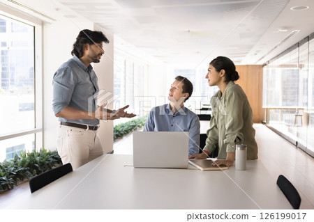 Teammates listen Indian middle-aged boss presenting new information Teammates listen Indian middle-aged boss presenting new information 126199017