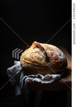 Appetizing sourdough bread with cracked crust 126199029
