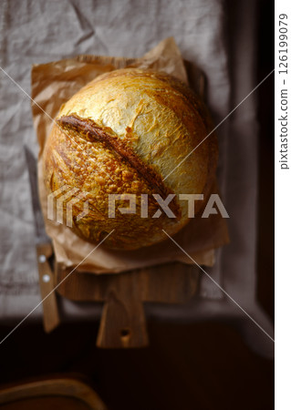 Top view on crusty sourdough bread with cracked crust 126199079