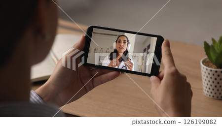 Woman engaging in videocall with doctor provide her medical consultation 126199082