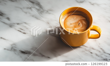 Warm cup of coffee resting on a marble countertop in the morning Warm cup of coffee resting on a marble countertop in the morning 126199123