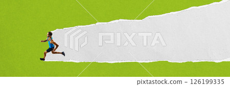 Runner in blue top and black shorts sprints forward on white torn paper path over green background. Handcut textured collage. 126199335