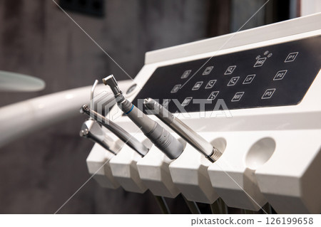 Close-up of dental control panel and handpieces 126199658
