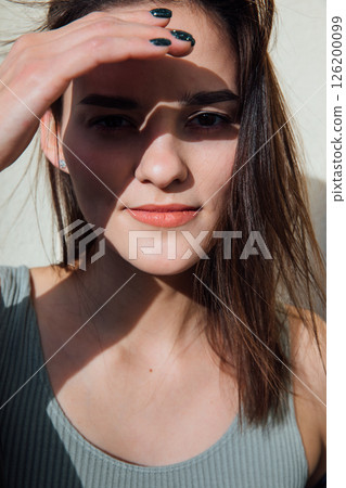 Face of gentle woman with hair portrait 126200099