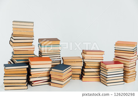 Stacks of educational books for learning on a white background 126200298