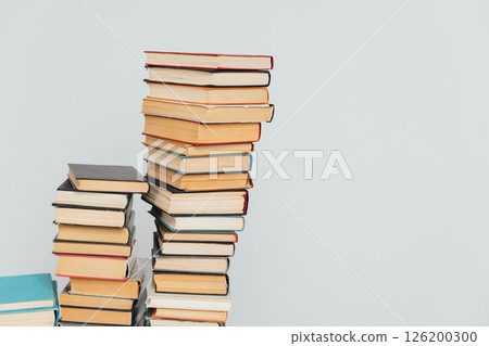 Stacks of educational books for learning on a white background Stacks of educational books for learning on a white background 126200300