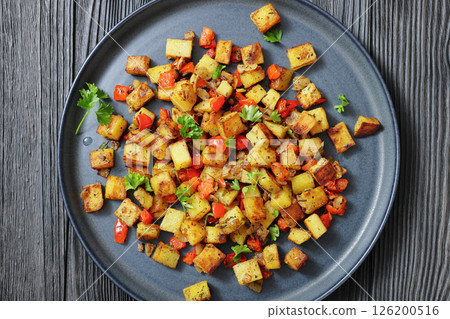 golden fried potatoes cubes with red bell pepper 126200516