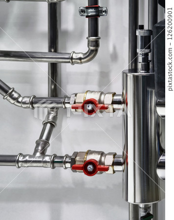 Industrial piping and valves system displayed in a modern facility for efficient fluid control 126200901
