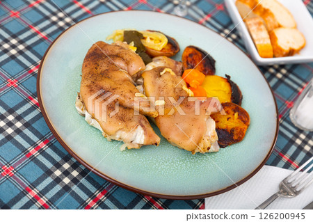 Stewed pig trotters with grilled potatoes and vegetables Stewed pig trotters with grilled potatoes and vegetables 126200945