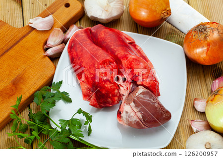 Raw lamb lungs and heart served with greens, nobody 126200957