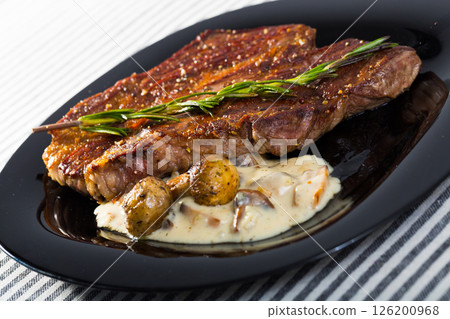 Roasted veal steak with mushroom sauce Roasted veal steak with mushroom sauce 126200968