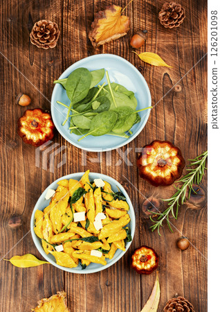 Cooked vegetarian pumpkin dumplings. 126201098